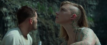 Movie still from “The Hunger Games: Mockingjay - Part 1” (2014), directed by Francis Lawrence – A man and a woman are looking into each other's eyes; Close Up shot, Low angle