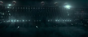 Movie still from “The Hunger Games: Mockingjay - Part 1” (2014), directed by Francis Lawrence – A stadium is lit up at night with lights on it; Extreme Wide shot, High angle
