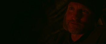 Movie still from “The Hunger Games: Mockingjay - Part 1” (2014), directed by Francis Lawrence – A person's face in the dark; Close Up shot, Over the shoulder angle