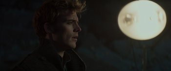 Movie still from “The Hunger Games: Mockingjay - Part 1” (2014), directed by Francis Lawrence – A person looking up at the sky; Close Up shot, Low angle