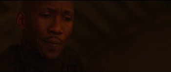 Movie still from “The Hunger Games: Mockingjay - Part 1” (2014), directed by Francis Lawrence – A man's face in the dark; Close Up shot, High angle