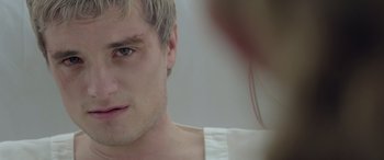Movie still from “The Hunger Games: Mockingjay - Part 2” (2015), directed by Francis Lawrence – A man's face in front of a mirror; Close Up shot, Over the shoulder angle
