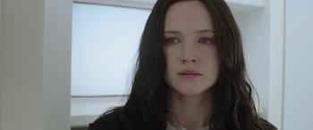 Movie still from “The Hunger Games: Mockingjay - Part 2” (2015), directed by Francis Lawrence – A person with long black hair; Close Up shot, Low angle