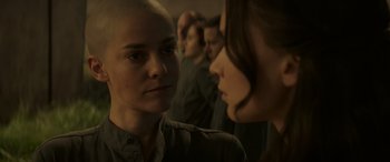 Movie still from “The Hunger Games: Mockingjay - Part 2” (2015), directed by Francis Lawrence – Two people are looking at each other in a room; Close Up shot, Over the shoulder angle