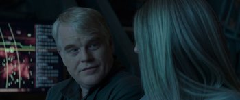 Movie still from “The Hunger Games: Mockingjay - Part 2” (2015), directed by Francis Lawrence – A man and a woman looking at one another in a mirror; Close Up shot, Over the shoulder angle
