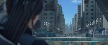 Movie still from “The Hunger Games: Mockingjay - Part 2” (2015), directed by Francis Lawrence – A view of a city from a distance; Extreme Wide shot, Over the shoulder angle