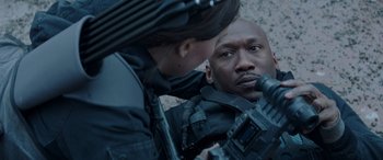 Movie still from “The Hunger Games: Mockingjay - Part 2” (2015), directed by Francis Lawrence – A man and a woman looking at one another; Close Up shot, Over the shoulder angle