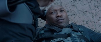 Movie still from “The Hunger Games: Mockingjay - Part 2” (2015), directed by Francis Lawrence – A man in a black jacket and a man in a black jacket; Close Up shot, High angle