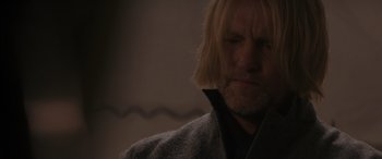 Movie still from “The Hunger Games: Mockingjay - Part 2” (2015), directed by Francis Lawrence – A person with long blonde hair; Close Up shot, Over the shoulder angle