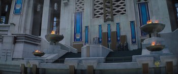 Movie still from “The Hunger Games: Mockingjay - Part 2” (2015), directed by Francis Lawrence – People are standing in front of a building with steps; Extreme Wide shot, High angle