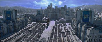 Movie still from “The Hunger Games: Mockingjay - Part 2” (2015), directed by Francis Lawrence – An aerial view of a large city with a lot of people; Extreme Wide shot, High angle