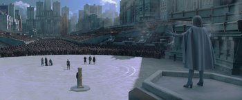 Movie still from “The Hunger Games: Mockingjay - Part 2” (2015), directed by Francis Lawrence – A group of people standing in front of a large crowd; Extreme Wide shot, High angle