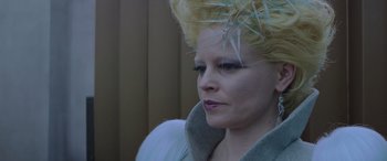 Movie still from “The Hunger Games: Mockingjay - Part 2” (2015), directed by Francis Lawrence – A person wearing a costume; Close Up shot, Low angle