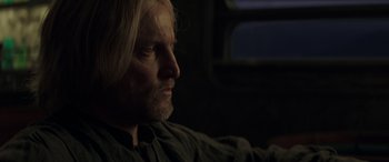 Movie still from “The Hunger Games: Mockingjay - Part 2” (2015), directed by Francis Lawrence – A person with long hair; Close Up shot, Over the shoulder angle