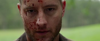 Movie still from “The Hunt” (2020), directed by Craig Zobel – A person with blood all over his face; Close Up shot, Low angle