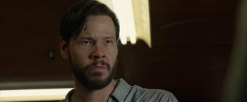 Movie still from “The Hunt” (2020), directed by Craig Zobel – A person with a beard; Close Up shot, Low angle