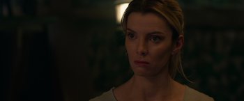 Movie still from “The Hunt” (2020), directed by Craig Zobel – A person looking at the camera; Close Up shot, Over the shoulder angle