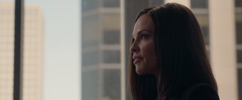 Movie still from “The Hunt” (2020), directed by Craig Zobel – A person with long brown hair; Close Up shot, Over the shoulder angle