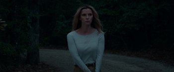 Movie still from “The Hunt” (2020), directed by Craig Zobel – A woman standing in the middle of a forest; Medium shot, Low angle