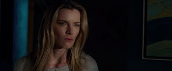 Movie still from “The Hunt” (2020), directed by Craig Zobel – A person with long blonde hair; Close Up shot, Low angle