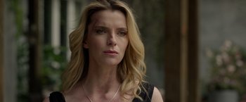 Movie still from “The Hunt” (2020), directed by Craig Zobel – A person with long hair; Close Up shot, Over the shoulder angle