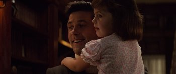 Movie still from “The Hunt for Red October” (1990), directed by John McTiernan – A man holding a little girl in his arms; Close Up shot, High angle