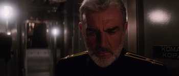 Movie still from “The Hunt for Red October” (1990), directed by John McTiernan – An older man in a military uniform stares into the distance; Close Up shot, Low angle