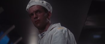 Movie still from “The Hunt for Red October” (1990), directed by John McTiernan – A person wearing a hat; Close Up shot, Low angle