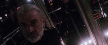 Movie still from “The Hunt for Red October” (1990), directed by John McTiernan – An older man with a gray beard wearing a military uniform; Close Up shot, Low angle