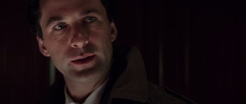 Movie still from “The Hunt for Red October” (1990), directed by John McTiernan – A man's face in the dark; Close Up shot, Low angle