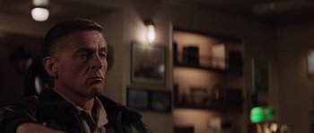 Movie still from “The Hunt for Red October” (1990), directed by John McTiernan – A person in a room; Close Up shot, Over the shoulder angle