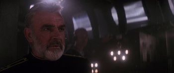 Movie still from “The Hunt for Red October” (1990), directed by John McTiernan – An older man with white hair and a gray beard is in the dark; Close Up shot, Low angle