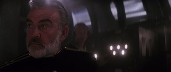 Movie still from “The Hunt for Red October” (1990), directed by John McTiernan – An older man in a military uniform looks at the camera; Close Up shot, Low angle