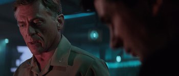 Movie still from “The Hunt for Red October” (1990), directed by John McTiernan – A man in a uniform talking to another man in a suit; Close Up shot, Over the shoulder angle