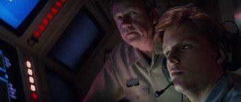 Movie still from “The Hunt for Red October” (1990), directed by John McTiernan – A man and a woman are looking at a computer screen; Close Up shot, Over the shoulder angle