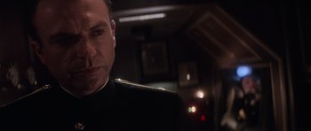 Movie still from “The Hunt for Red October” (1990), directed by John McTiernan – A person wearing a military uniform; Close Up shot, Low angle