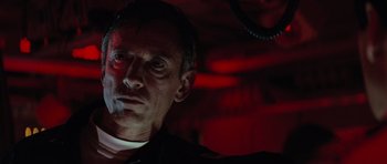 Movie still from “The Hunt for Red October” (1990), directed by John McTiernan – A person in a dark room; Close Up shot, Low angle
