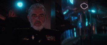 Movie still from “The Hunt for Red October” (1990), directed by John McTiernan – An older man in a military uniform looking at the camera; Close Up shot, Low angle