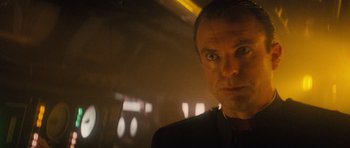 Movie still from “The Hunt for Red October” (1990), directed by John McTiernan – A person in a dark room; Close Up shot, Over the shoulder angle