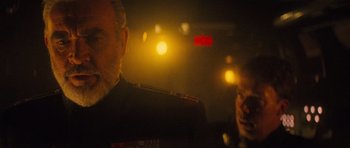 Movie still from “The Hunt for Red October” (1990), directed by John McTiernan – A man in a military uniform and a woman in a military uniform; Close Up shot, Over the shoulder angle