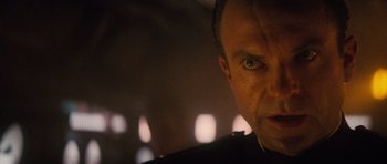 Movie still from “The Hunt for Red October” (1990), directed by John McTiernan – A man's face in the dark; Close Up shot, Over the shoulder angle