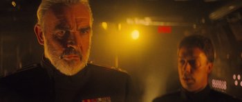 Movie still from “The Hunt for Red October” (1990), directed by John McTiernan – An older man in a military uniform stares at the camera; Close Up shot, Low angle