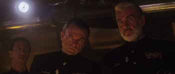 Movie still from “The Hunt for Red October” (1990), directed by John McTiernan – Two men in military uniforms looking at the camera; Close Up shot, Low angle