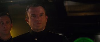 Movie still from “The Hunt for Red October” (1990), directed by John McTiernan – A person wearing a uniform; Close Up shot, Low angle