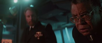 Movie still from “The Hunt for Red October” (1990), directed by John McTiernan – Two men in military uniforms on a boat; Close Up shot, Over the shoulder angle