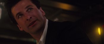 Movie still from “The Hunt for Red October” (1990), directed by John McTiernan – A person wearing a suit and tie; Close Up shot, Low angle