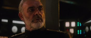 Movie still from “The Hunt for Red October” (1990), directed by John McTiernan – An older man with a beard looking into a mirror; Close Up shot, Low angle