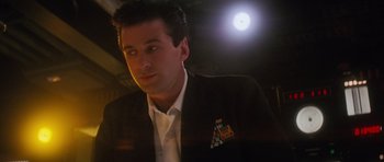 Movie still from “The Hunt for Red October” (1990), directed by John McTiernan – A person wearing a suit and tie; Close Up shot, Low angle