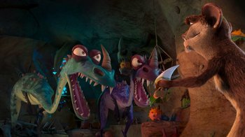Movie still from “The Ice Age Adventures of Buck Wild” (2022), directed by John C. Donkin – A group of dinosaurs that are in a cave; Wide shot, High angle