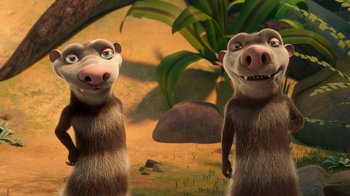 Movie still from “The Ice Age Adventures of Buck Wild” (2022), directed by John C. Donkin – A couple of monkeys standing next to each other in the grass; Medium shot, Low angle